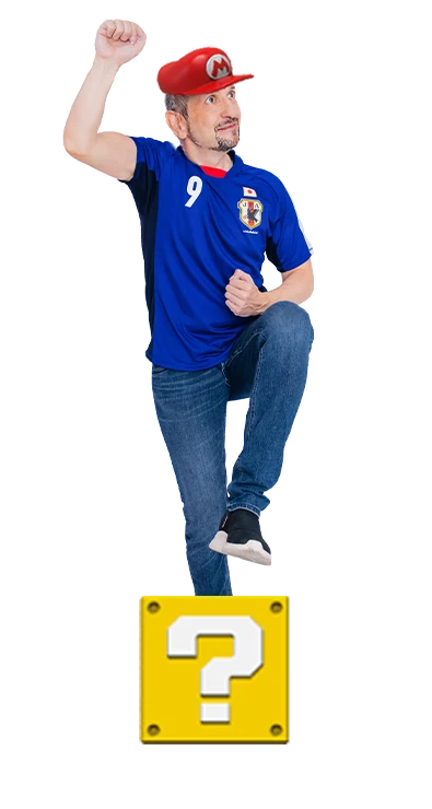 Mag. Bernhard Steger jubelt in Fussballpose mit erhobener Faust und energischem Schritt nach vorne - sportlich, leidenschaftlich und voller Teamgeist.